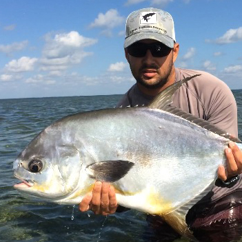 upper keys fishing charters client with permit